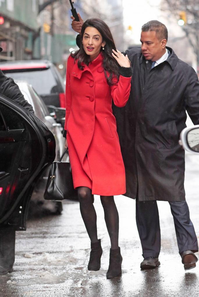 בלעדי: Amal Alamuddin Clooney wears a red coat while navigating the snow storm in New York City