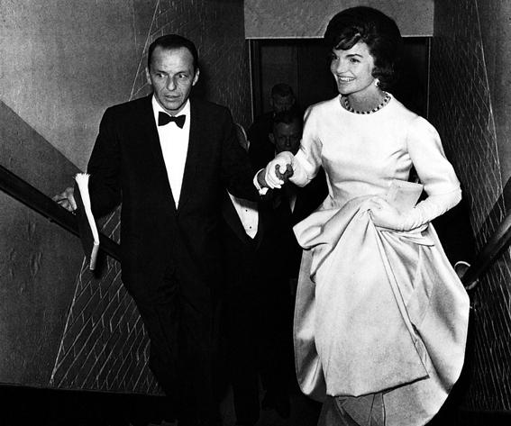 ג'קי Onassis, Frank Sinatra escorting Jacqueline Kennedy to her box at a gala