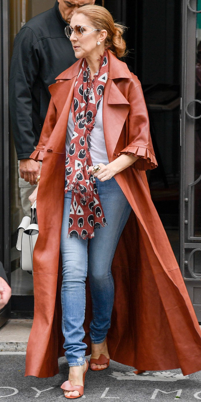 In A BRICK RED LEATHER COAT 