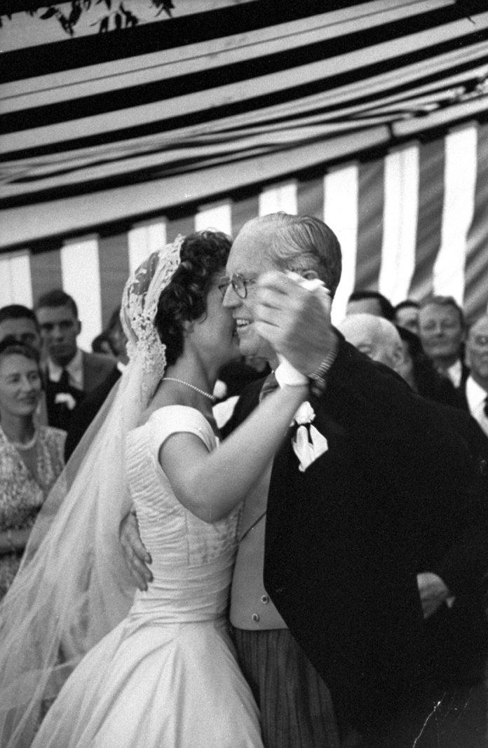 ה groom's father dancing with Jackie Kennedy 