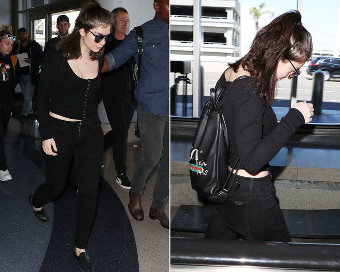 ロルド Carries Gucci Drawstring Backpack at the Airport