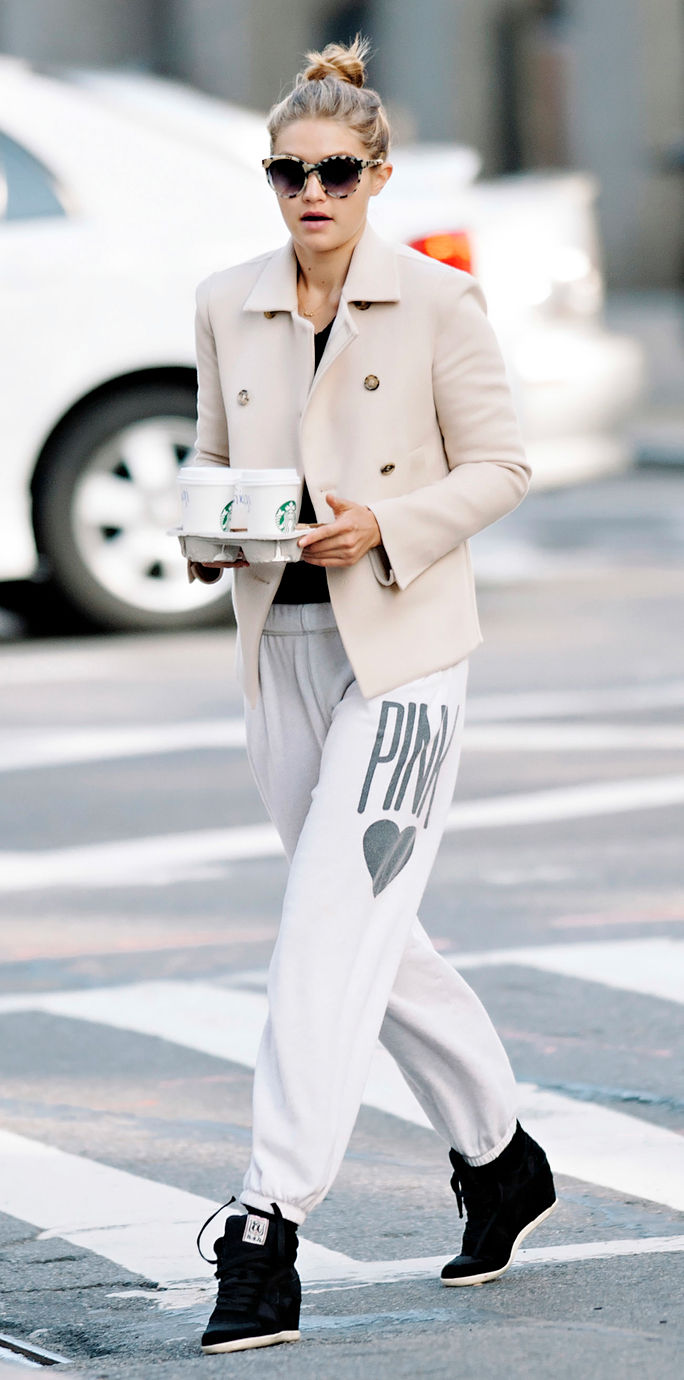 ג'יג'י Hadid seen wearing white blazer and sweatpants while making a coffee run in NYC
