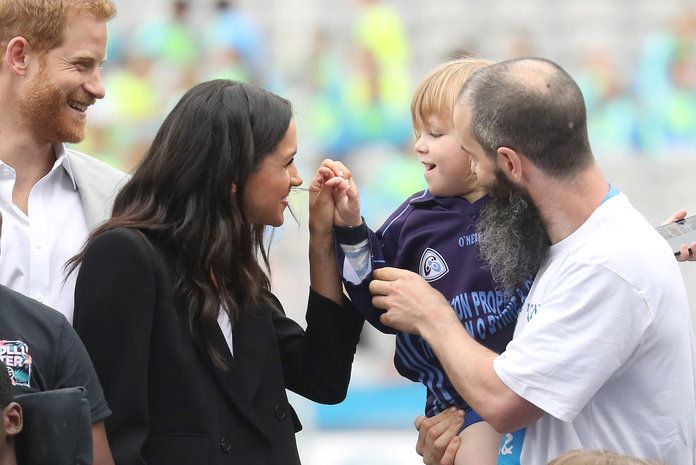 Meghan and Harry with a kid embed 3